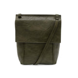 With a slim, streamlined look, this vegan leather crossbody in a beautiful dark olive color features a top flap with magnetic snap closure and an adjustable shoulder strap so you can carry it as a crossbody or a shoulder bag. With two convenient slip pockets, one under the flap and one on the back you can keep your phone and keys in easy reach.


Dimensions: 9.5 in. H x 8 in. W x 2.75 in. D
Magnetic snap closure
Adjustable shoulder strap: 14 in. - 27.5 in. drop
Brass plated hardware
100% Vegan leather (poly