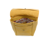 With a slim, streamlined look, this vegan leather crossbody in a beautiful laguna yellow color features a top flap with magnetic snap closure and an adjustable shoulder strap so you can carry it as a crossbody or a shoulder bag. With two convenient slip pockets, one under the flap and one on the back you can keep your phone and keys in easy reach.


Dimensions: 9.5 in. H x 8 in. W x 2.75 in. D
Magnetic snap closure
Adjustable shoulder strap: 14 in. - 27.5 in. drop
Brass plated hardware
100% Vegan leather (p