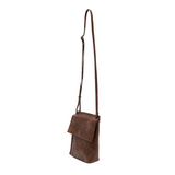 With a slim, streamlined look, this vegan leather crossbody in a beautiful pecan color features a top flap with magnetic snap closure and an adjustable shoulder strap so you can carry it as a crossbody or a shoulder bag. With two convenient slip pockets, one under the flap and one on the back you can keep your phone and keys in easy reach.


Dimensions: 9.5 in. H x 8 in. W x 2.75 in. D
Magnetic snap closure
Adjustable shoulder strap: 14 in. - 27.5 in. drop
Brass plated hardware
100% Vegan leather (polyureth