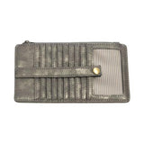 This slim and sleek wallet has nine credit card pockets, each with a snap tab for security and brass-plated hardware. It also features an ID window, a zippered change pocket, and a zippered billfold pocket in metallic dark chrome vegan leather.


DIMENSIONS: 3.75 IN. H X 7.25 IN. W X .25 IN. D&nbsp;


100% Vegan leather (polyurethane)
