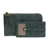 Karina combines sleek styling with uber organization in a beautiful faux suede deep teal leather. The ultimate in versatility, this bag can be worn as a crossbody, carried as a clutch or as a wristlet. The included bonus wallet with credit card slots, ID windows, zippered change pocket and billfold will keep your organized on the go and can be carried separately.


Product Details
Main Bag
Dimensions: 9.75 in. W x 6 in. H x 1 in. D
Zippered Top Closure
Exterior Open Pocket
Interior Zipper Pocket
Detachable 