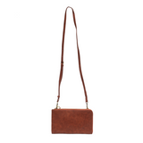 The Karina combines sleek styling with uber organization in beautiful antique-looking cinnamon colored vegan leather! This bag has the ultimate versatility, as it can be worn as a crossbody, a clutch, or a wristlet. The bonus wallet, which includes credit card slots, ID windows, a zippered change pocket, and a billfold, will keep you organized and can be carried separately!


MAIN BAG: 9"H x 6"W x 1"D



Removable and adjustable crossbody strap 21"-26" with lobster claw clasps

Removable long wristlet strap