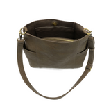 Brown leather handbag with a strap on a white background