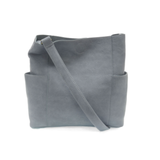 Casual and carefree crossbody in super soft pebble grain vegan leather! Our Kayleigh bucket bag in a beautiful dusty blue color comes with a smaller bag in the same color that can be carried inside or used alone! The convenient side pockets of this bucket bag can carry your water bottle, phone, or glasses.&nbsp;




11" W X 11.25" H X 3.5"
Magnetic Snap Closure
2 open and 1 zipper interior pockets
2 exterior open pockets and 1 back zipper pocket
12- 18" adjustable drop and detachable crossbody strap with lo