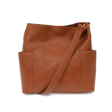 Brown leather tote bag with a shoulder strap on a white background