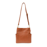 Brown leather tote bag with a strap on a white background