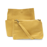 Casual and carefree crossbody in super soft pebble grain vegan leather! Our Kayleigh bucket bag in a beautiful butter yellow&nbsp;comes with a smaller bag that can be carried inside or used alone! The convenient side pockets of this bucket bag can carry your water bottle, phone or glasses.&nbsp;


11" W X 11.25" H X 3.5"
Magnetic Snap Closure
2 open and 1 zipper interior pockets
2 exterior open pockets and 1 back zipper pocket
12- 18" adjustable drop and detachable crossbody strap with lobster claw clasps
B