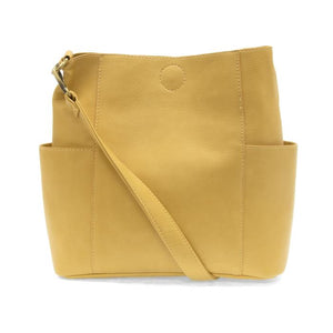 Casual and carefree crossbody in super soft pebble grain vegan leather! Our Kayleigh bucket bag in a beautiful butter yellow&nbsp;comes with a smaller bag that can be carried inside or used alone! The convenient side pockets of this bucket bag can carry your water bottle, phone or glasses.&nbsp;


11" W X 11.25" H X 3.5"
Magnetic Snap Closure
2 open and 1 zipper interior pockets
2 exterior open pockets and 1 back zipper pocket
12- 18" adjustable drop and detachable crossbody strap with lobster claw clasps
B