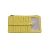This slim and sleek wallet has nine credit card pockets, each with a snap tab for security and brass-plated hardware. It also has an ID window, zippered change pocket, and zippered billfold pocket in distressed beautiful key lime vegan leather.


DIMENSIONS: 3.75 IN. H X 7.25 IN. W X .25 IN. D&nbsp;


100% Vegan leather (polyurethane)