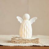 This white stoneware angel will bring an understated charm to your holiday decor this year!

Approximately 3.5"L x 2.25"W x 4.5"H

Batteries included