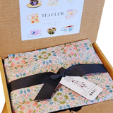 Happy May Day! Can you believe it's already May? We are thrilled to introduce this month's box, which we've been eagerly anticipating! Imagine indulging in a delightful assortment of tea infused with the vibrant essence of flowers and fruit. We are confident you will love our May Day Box! Included inside, you'll find one of our favorite scone recipes to try out. Plus, we've added some rose petals and lavender buds to elevate the icing—trust us, it's a treat you won't want to miss!