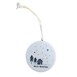 The&nbsp;"Merry Christmas" Porcelain Heart Ornament features two pine trees and a coy cabin with stars and a snowy background. The back of the ornament features&nbsp;six pine trees with the same snowy, starry sky.  2" Dia
