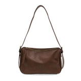 Ready to add a slouchy cool bag to your wardrobe rotation? Look no further than the Morgan in russet! The top zip closure conceals a roomy interior that has space for a large wallet, max size phone, glasses, make-up bag and more. Created in softly tumbled vegan leather and accented with bold golden buckles that make a statement, this soft shape will take you from the office to the party and back again!

Dimensions: 7.5 in. H X 11.5 in. W X 4.5 in. D
Top zip closure
Adjustable shoulder strap: 12 - 18.5 in. d