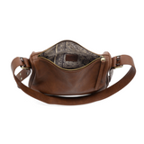 Ready to add a slouchy cool bag to your wardrobe rotation? Look no further than the Morgan in russet! The top zip closure conceals a roomy interior that has space for a large wallet, max size phone, glasses, make-up bag and more. Created in softly tumbled vegan leather and accented with bold golden buckles that make a statement, this soft shape will take you from the office to the party and back again!

Dimensions: 7.5 in. H X 11.5 in. W X 4.5 in. D
Top zip closure
Adjustable shoulder strap: 12 - 18.5 in. d