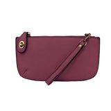 Our most popular bag, in a beautiful mulberry, this mini clutch, with its sleek silhouette, is as gorgeous as it is versatile.&nbsp; Features include a polished turn lock, six card slots, and an interior zipper for change.&nbsp; It can be styled in many ways, with removable straps for alternating between wallet, crossbody, and wristlet!

&nbsp;5"H x 9.5"W x 1"D

Removable and adjustable crossbody strap 13"-24"

Wristlet strap 7" long

interior zippered pocket

brass plated hardware

100% vegan leather (poly