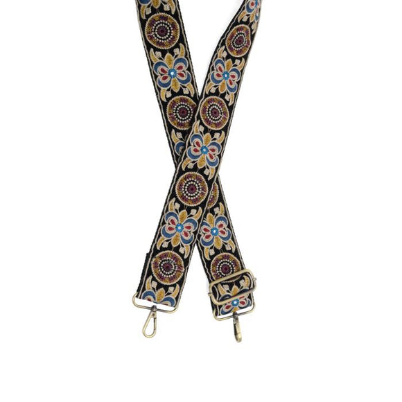 Make your purse or crossbody HAPPY with this fun black guitar strap with embroidered designs in turquoise, reds and golds with mirror accents going down it! The back of the strap is black.

2