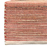 Need to add a little texture to your home? You'll love this incredibly stylish, sustainable, and durable hand-woven khaki and rust and orange-colored table runner. It will surely enrich the décor of any surface in your home. Made with Jute and cotton, these runners are environmentally friendly, sustainable, trendy, and stylish.  13" W x 72"L  Spot clean only.  Jute &amp; Cotton  Handmade in India