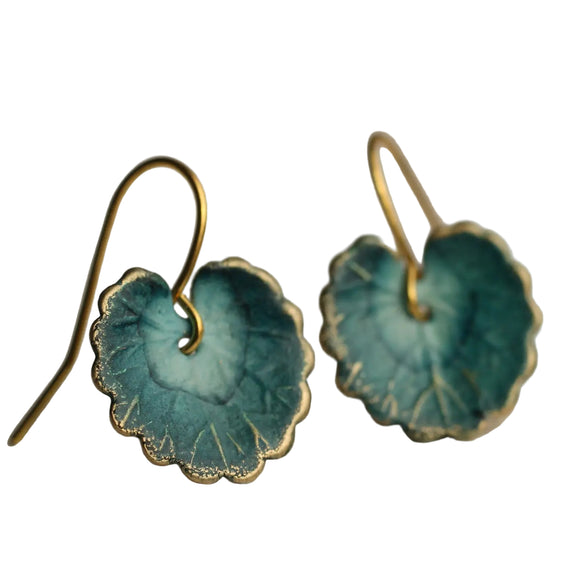 These leaf earrings are brass charms with some amazing detail, which have been carefully painted and varnished to bring out beautiful, cool toned shades of French navy blue. They remind us of beautiful watercolour lily pads from a Monet painting.

The earrings are just shy of 1