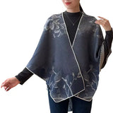 Cozy Cashmere Like Travel Wrap This one size fits all reversible loop wrap, drapes over and through shoulder loop to stay in place. Accents any outfit, casual or dressy. It feels and looks like cashmere. A beautiful layering piece!

60% Poly, 40% Acrylic.

Dry clean or hand wash cold with light colors, lay flat to dry, iron on lowest setting if need, do not bleach.