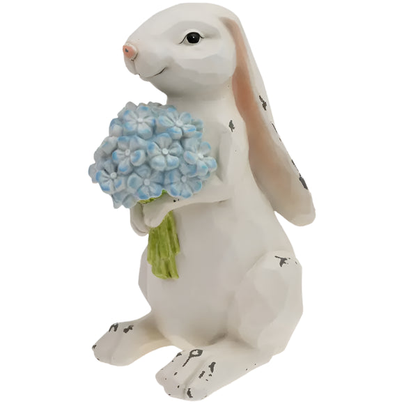 This spring, you need this whimsical little guy! Nibbles the bunny is clutching a bouquet of blue hydrangeas. This rustic resin bunny with hand-painted details, is sure to bring a smile to your decor!

6