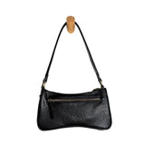 Meet Nicolette, our sleek, curvy black colored crossbody pochette with a minimalist style. Featuring soft sculptural curves in tumbled vegan leather, this bag is closed with a brass zipper that encloses 3 interior compartments to keep your cards, cash, keys and phone stowed neatly. The gleaming brass rings open to swap out the two included shoulder straps. A short strap for dressier looks and a longer adjustable crossbody strap when you want to go hands free. The Nicolette will add a stylish pop to your loo