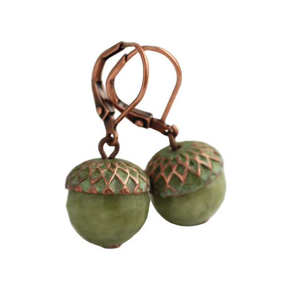 These olive green acorn earrings are made from authentic natural jade gemstone with antique copper. The copper has been hand enamelled to produce a rustic, weathered verdigris appearance. The tones of the tarnished red copper with the warm olive green of the gemstone look great together. 

The earring measures just over 1