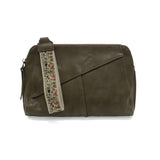 Retro styling crafted in antiqued vegan leather gives this beauitful olive colored clutch a vintage vibe. The removable woven wrist strap is the finishing touch on this stylish bag, so you can wear as a wristlet, a clutch, or even a crossbody with the included removable shoulder strap!





6.75"H x 9.75"W x 2.25"D

Removable and adjustable crossbody strap 22"-26"

Removable long wristlet strap 7.5" long

Zippered top closure

Interior zippered pocket

Exterior back zipper pocket

Brass plated hardware

100