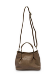 Accented by deep pleats this slouchy satchel bag crafted in softly tumbled olive colored vegan leather gives a modern yet feminine vibe to your look. Stay organized with three interior compartments including one zipper and two magnetic snap closures, with space for your wallet, phone, cosmetics and more. Featuring both top handles and a removable shoulder strap, this versatile crossbody bag will accent all your looks from casual to dressy.
Product Details
Dimensions: 8.25 in. H x 10.5 in. W x 4 in. D
3 Inte