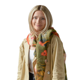 This olive scarf features beautiful florals and leaves in cream, orange, fuchsia, gold, and navy.

180" L x 88" W

100% Polyester