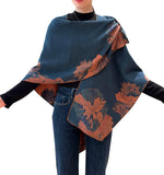 This cozy Cashmere Feel Travel Loop Wrap features a beautiful orange-and-navy floral and fan-leaf pattern. One side has an orange background with a navy pattern; the other has a navy background with an orange pattern. This one-size-fits-all reversible loop wrap drapes over and accents any outfit, casual or dressy. It has a loop on both sides to make it truly reversible. Wear looped to stay in place or wear loosely as a shawl. It feels and looks like cashmere. A beautiful layering piece!&nbsp;

85% Poly, 15%
