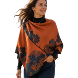 This cozy Cashmere Feel Travel Loop Wrap features a beautiful orange-and-navy floral and fan-leaf pattern. One side has an orange background with a navy pattern; the other has a navy background with an orange pattern. This one-size-fits-all reversible loop wrap drapes over and accents any outfit, casual or dressy. It has a loop on both sides to make it truly reversible. Wear looped to stay in place or wear loosely as a shawl. It feels and looks like cashmere. A beautiful layering piece!&nbsp;

85% Poly, 15%