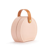 A beautiful gift for yourself or a friend, this traveling jewelry case is pink with a brown strap closure. Inside there is room for your jewelry for a short weekend or a couple of weeks!

Foam, metal, paper, polyester fiber, polyurethane

2.5" h x 4.5" w x 4.5" d