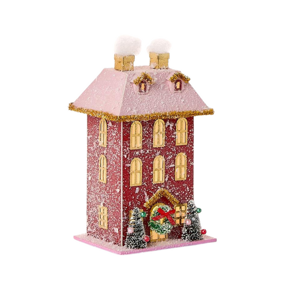 Create a cozy winter wonderland with our battery opperated cardboard village house! This house has a pink snow covered roof and a pink base with two trees beside the snow covered red house. With Gold accented windows on the front and sides, it will bring a warm glow to your home this year!

Battery operated (included)

7.5