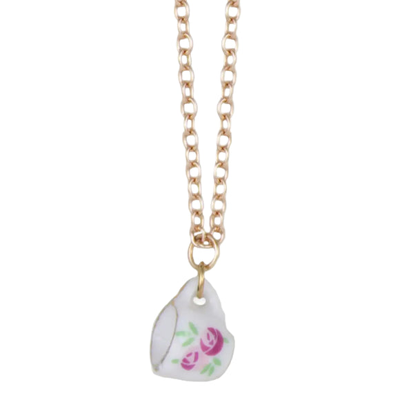 Enjoy this fashionable teatime treasure necklace. A charming gold chain graced with a ceramic pendant shaped like a tiny tea cup, featuring soft pink flower design. This delightful piece brews a blend of whimsy and elegance, perfect for those who savor life's cozy moments.

Made in China

Genuine ceramic tea pot pendant

Measures: Measurements: 16-18