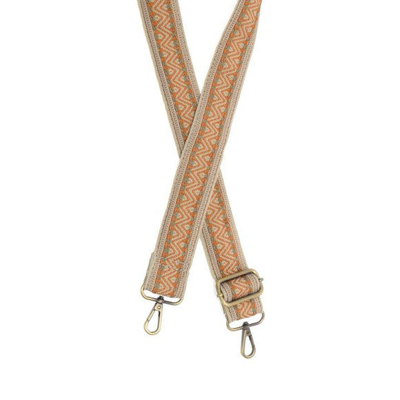 Make your purse or crossbody HAPPY with this fun striped guitar strap with a cream background and pumpkin chevron design with grey accents going down the strap with a brown stripe border! The back of the strap is off white/cream.

1.5