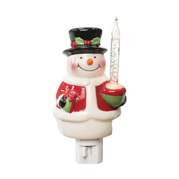 Bring a nostalgic glow to holiday decor with this night light. Featuring a jolly snowman with a classic top hat and coat, this charming decoration lights up when plugged into an electrical outlet, evoking the magic of vintage Christmases. This earthenware bubble light connects to an outlet with an input of AC 120V.

Crafted of earthenware, plastic, glass.

3.4 x 3.2 x 6.1 in