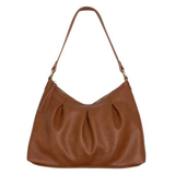 The Sasha Hobo is made of gently tumbled vegan leather in saddle, accented with soft pleats and closed with a brass zipper. This crossbody is so versatile with 2 different interchangeable shoulder straps included, just open the gleaming brass rings to change from a short shoulder strap to a longer adjustable crossbody strap.
Product Details
Dimensions: 9.5 in. H x 12.5 in. W x 3.5 in. D
Top zip closure
Brass plated hardware
Logo zipper pulls
Opening brass rings to change between the included shoulder straps