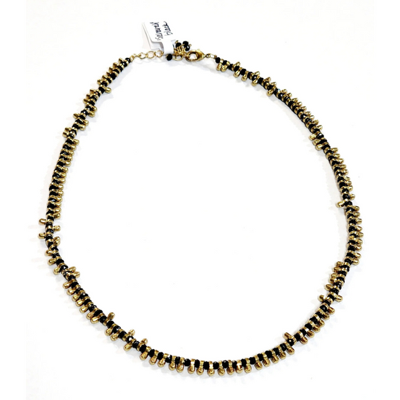 A great necklace to wear with anything! It has alternating brass toggled beads and black beads, creating a beautiful design. This 17