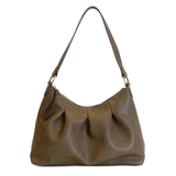 The Sasha Hobo is made of gently tumbled vegan leather in olive, accented with soft pleats and closed with a brass zipper. This crossbody is so versatile with 2 different interchangeable shoulder straps included, just open the gleaming brass rings to change from a short shoulder strap to a longer adjustable crossbody strap.
Product Details
Dimensions: 9.5 in. H x 12.5 in. W x 3.5 in. D
Top zip closure
Brass plated hardware
Logo zipper pulls
Opening brass rings to change between the included shoulder straps
