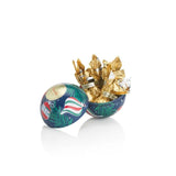 Venchi's Ball Metal Chocolate Blue Tin Christmas Ornament adds festive shimmer to the holiday season. Shaped like a Christmas tree ornament, this tin features whimsical Christmas illustrations and holds a selection of milk and dark cream and crunchy chocolates inside. Each reusable tin offers a refined presentation that doubles as keepsake décor long after the chocolate inside is gone, with festive artwork designed to display on the tree or wherever holiday decorations gather

Gluten-free chocolate made in 