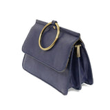 Put a ring on it! Perfect for your next night out, this cute blueberry colored bracelet bag looks great with your fav jeans or slinky dress! With multiple compartments, it is just the right size to hold all your essentials. Wear it on your wrist with the metallic ring bracelet, or carry as a clutch, or wear as a crossbody with the detachable shoulder strap.


Dimensions: 6 in. H x 8.25 in. W x 3.5 in. at deepest point
Tapers up to the top point
Adjustable and removable crossbody strap: 20-25 in.
3 in. diame
