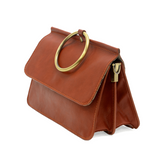 Put a ring on it! Perfect for your next night out, this cute terracotta bracelet bag looks great with your fav jeans or slinky dress! With multiple compartments, it is just the right size to hold all your essentials. Wear it on your wrist with the metallic ring bracelet, or carry as a clutch, or wear as a crossbody with the detachable shoulder strap.


Dimensions: 6 in. H x 8.25 in. W x 3.5 in. at deepest point
Tapers up to the top point
Adjustable and removable crossbody strap: 20-25 in.
3 in. diameter rin