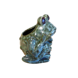 We adore this charming green pottery frog planter! It features an opening in the back, allowing you to place a plant in it or store any treasures you need a spot for!

Frog is approximately 4.25" H x 4.25" W x 3.5" D