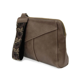 Retro styling crafted in antiqued vegan leather gives this taupe clutch a vintage vibe. The removable woven wrist strap is the finishing touch on this stylish bag so you can wear it as a wristlet, a clutch, or a crossbody with the included removable shoulder strap!





6.75"H x 9.75"W x 2.25"D

Removable and adjustable crossbody strap 22"-26"

Removable long wristlet strap 7.5" long

Zippered top closure

Interior zippered pocket

Exterior back zipper pocket

Brass plated hardware

100% vegan leather (poly