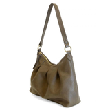 The Sasha Hobo is made of gently tumbled vegan leather in olive, accented with soft pleats and closed with a brass zipper. This crossbody is so versatile with 2 different interchangeable shoulder straps included, just open the gleaming brass rings to change from a short shoulder strap to a longer adjustable crossbody strap.
Product Details
Dimensions: 9.5 in. H x 12.5 in. W x 3.5 in. D
Top zip closure
Brass plated hardware
Logo zipper pulls
Opening brass rings to change between the included shoulder straps
