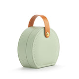 A beautiful gift for yourself or a friend, this traveling jewelry case is green with a brown strap closure. Inside there is room for your jewelry for a short weekend or a couple of weeks!

Foam, metal, paper, polyester fiber, polyurethane

2.5" h x 4.5" w x 4.5" d