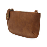 Our bestselling crossbody turn lock clutch has been re-imagined in soft, vegan suede leather in walnut. Sleek and versatile with removable straps, this style can be worn as a Crossbody, carried as a wristlet or a clutch, even doubles as a wallet! With interior credit card slots and enough space to carry your phone, sunglasses, and any other must-haves, all held securely by our locking closure. This casual style is destined to become your new go-to favorite all year long.
Product Details
Dimensions: 5 in. H 