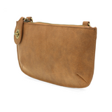 Our bestselling crossbody turn lock clutch has been re-imagined in soft, vegan suede leather in wheat. Sleek and versatile with removable straps, this style can be worn as a Crossbody, carried as a wristlet or a clutch, even doubles as a wallet! With interior credit card slots and enough space to carry your phone, sunglasses, and any other must-haves, all held securely by our locking closure. This casual style is destined to become your new go-to favorite all year long.
Product Details
Dimensions: 5 in. H x