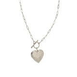 This sweet heart locket has a link 16+ chain with the trending fake toggle closure at the top of the heart. The heart has beautiful scrolling on it and opens to put two pictures inside. It has a lobster clow hook/closure at the top of the chain.

The necklace is 19" from the top of the clasp to the end ring