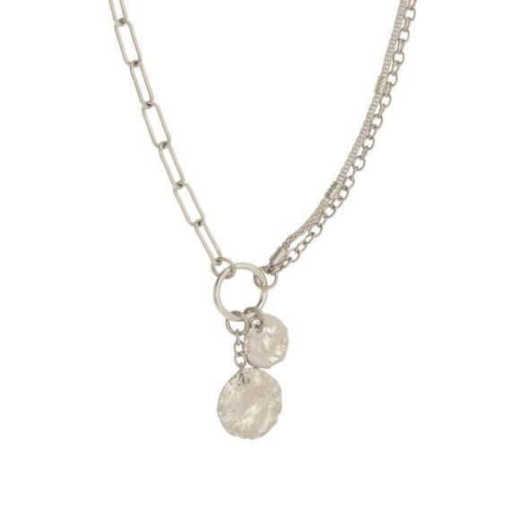 This pretty necklace has three different types of linked silver chains with a lobster clasp on this 16+ chain. There is a silver ring at the bottom that holds two shiny silver discs, one larger than the other. 

The necklace is 8.75